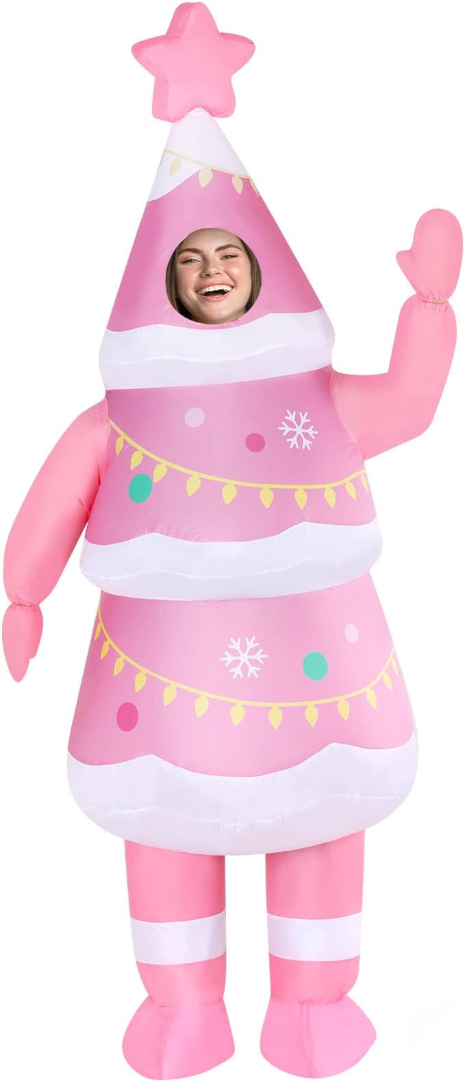 Person wearing a pink inflatable Christmas tree costume with a star on top.