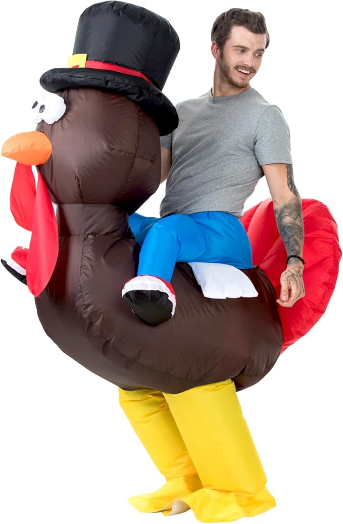 Man wearing an inflatable turkey costume on a white background